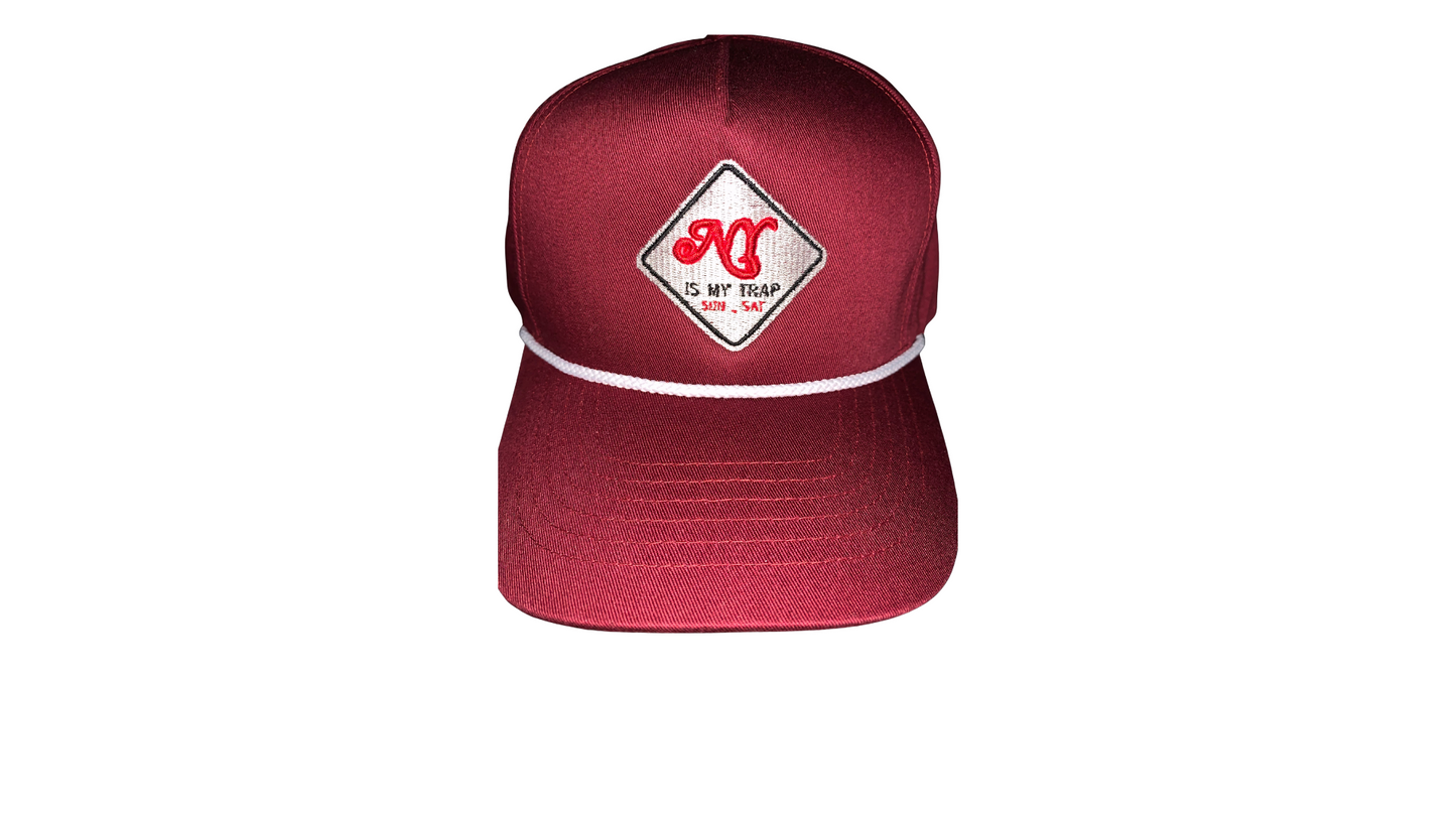 burgandy snapback with a white embroidered ny is my trap sun-sat logo