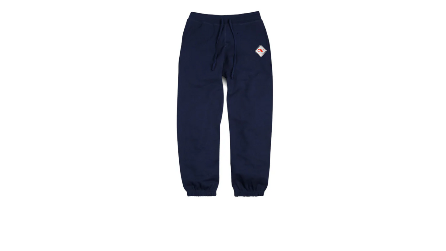 navy blue "CHI IS MY TRAP" embroidered jogger pants featuring the "chi is my trap Sun–Sat" slogan stitched down the leg. Premium streetwear inspired by Chicago grind culture and everyday hustle.