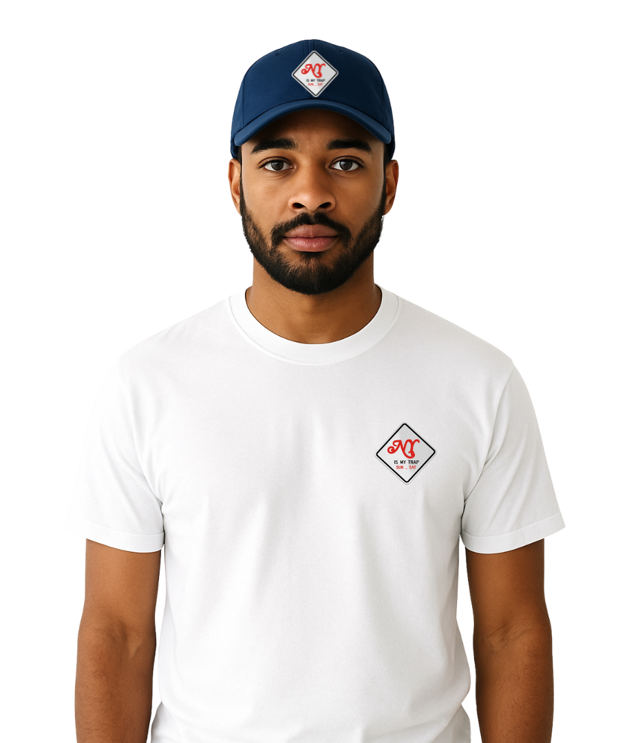 Person wearing a white t-shirt with a embroidered ny is my trap sun-sat logo and a blue cap with embroidered ny is my trap sun-sat logo