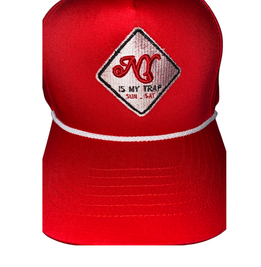 Red snapback with a white embroidered ny is my trap sun-sat logo