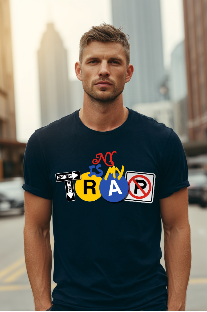 Man wearing navy blue streetwear t-shirt with ny is my trap text colorful graphics and text in an urban setting